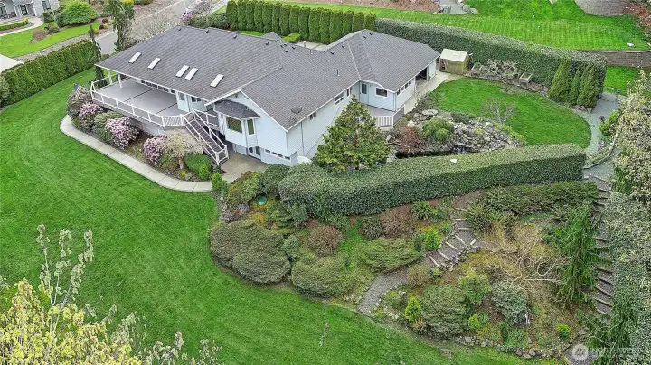 Well-maintained grounds with a wraparound feel and inviting outdoor living areas.