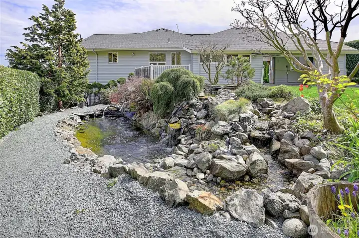 Beautifully designed water feature creates a peaceful, park-like setting.