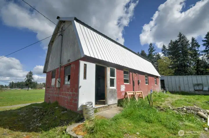 back of barn, newer metal roof. So much potential to bring new life to this old barn!