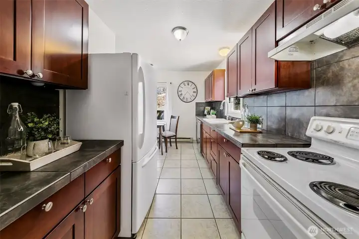 Cherry cabinets and granite tile counters