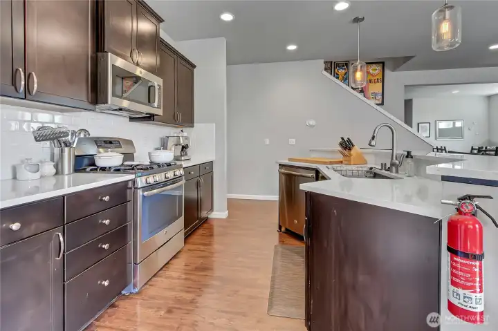 Generous cabinets, Quartz counters, stainless appliances and attractive floors will make this the kitchen everyone enjoys.