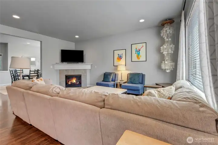 The living room is large enough to accommodate a large comfy couch while you enjoy the fireplace.   Just off the living room is your dining room.