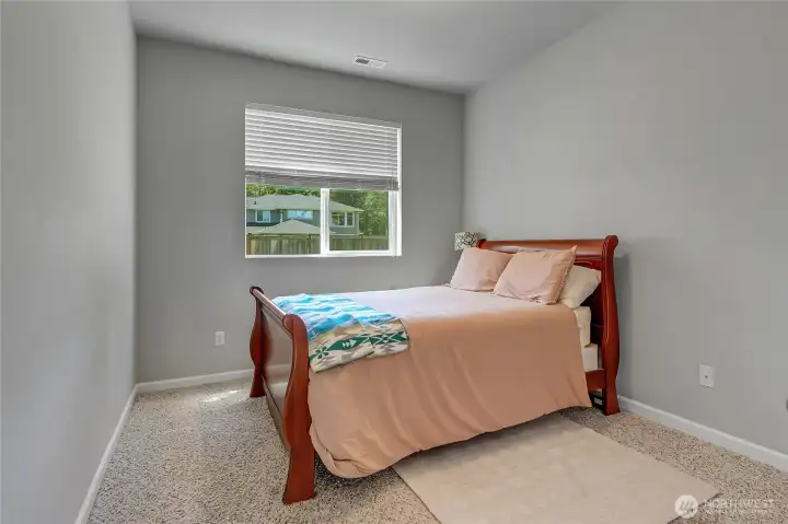 Upstairs bedroom looks into the backyard.
