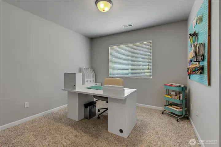 This upstairs bedroom is currently used as an office.  It's a generous size with plenty of options.