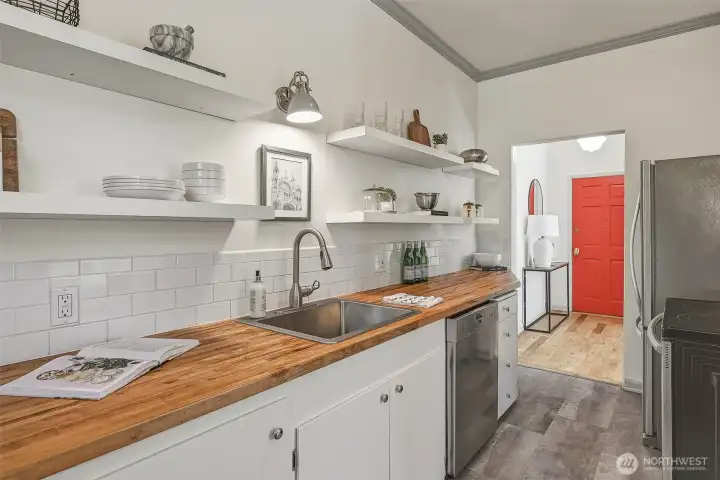 Stylishly updated kitchen with modern, open shelving.