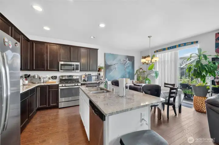 Kitchen with island and dining area Kitchen with island and dining area