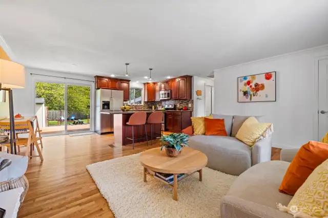 Open great room is filled with natural light.  Original oak hardwood floors are through-out the main level.
