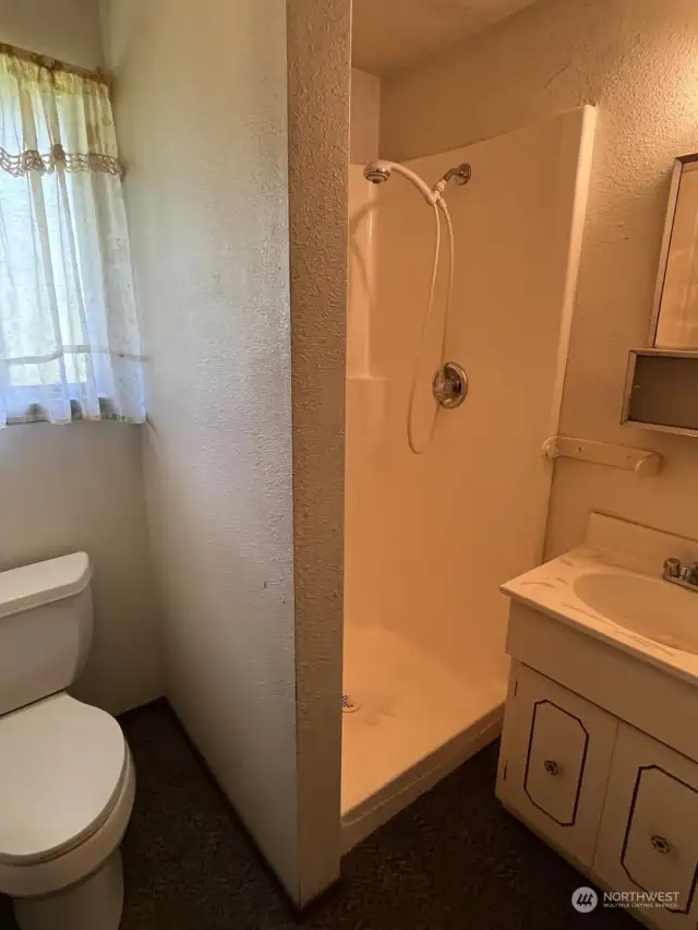 3/4 Bath off Laundry Room and near Office.