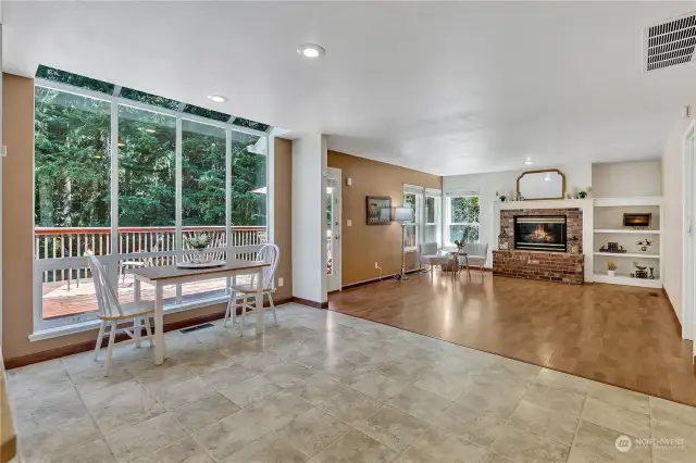Attached dining area with floor to ceiling windows lets in so much light! A strong connection to the outside and walk out access to the rear deck.