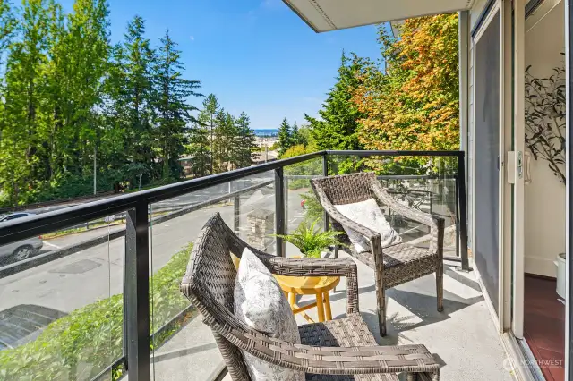 West facing deck with partial views of the lake and mountains