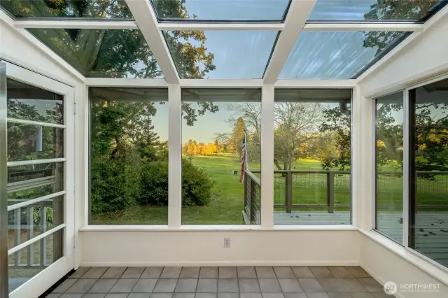 The Solarium of the kitchen with views of the 7th Fairway. Watch the golfer's take their swings.