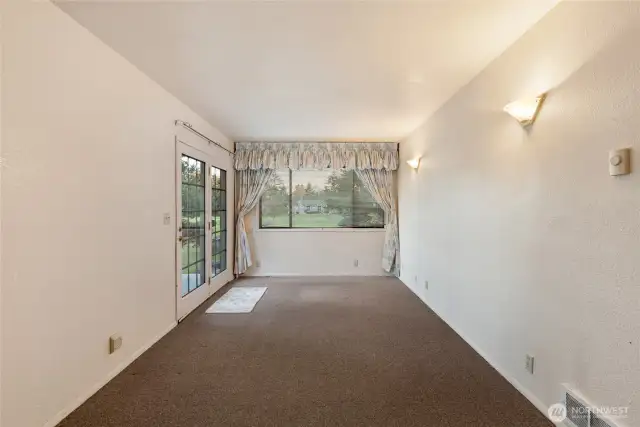 The bonus room with glass doors to the lower level of the deck.