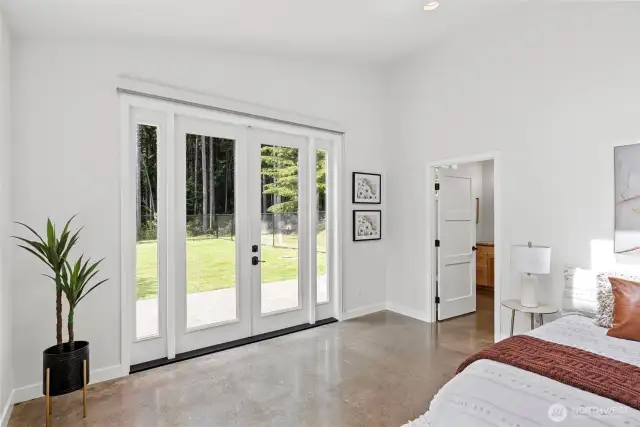 French doors to patio and fenced backyard.