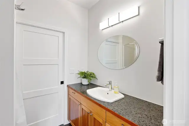 Junior suite with second access, convenient to back patio.