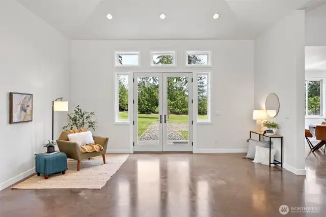 Grand entrance thru French doors, this home features custom concrete floors thruought (great for both allergies and wheelchairs)