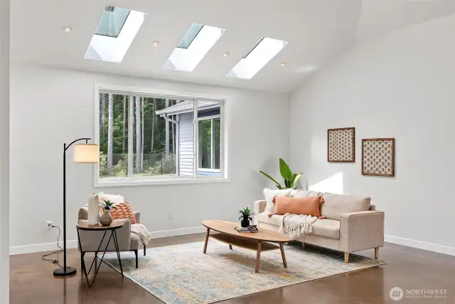 Skylights keep the house extra light and bright. Large living room area.