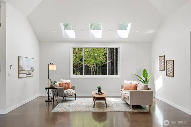 Living room with great view of fenced backyard.
