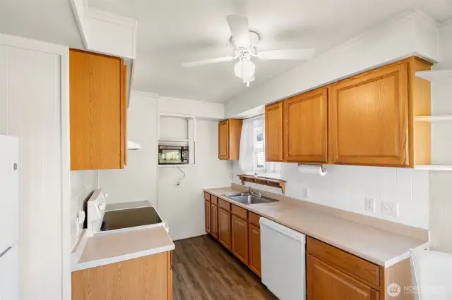 Kitchen has plenty of storage, and a space for dining.