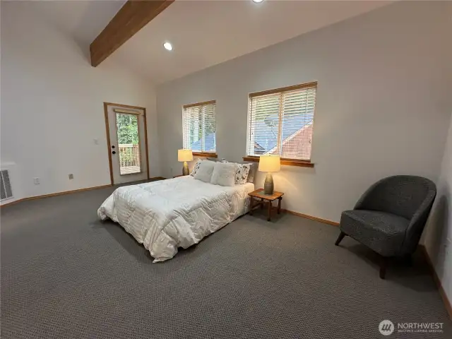 Primary bedroom with exterior access and deck.