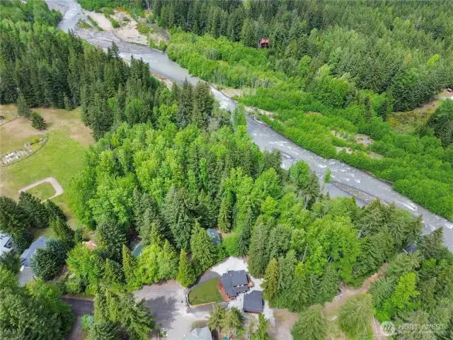 Aerial photo shows  community greenbelt & play field to the back of the property.  It's a quick hike to the White River.
