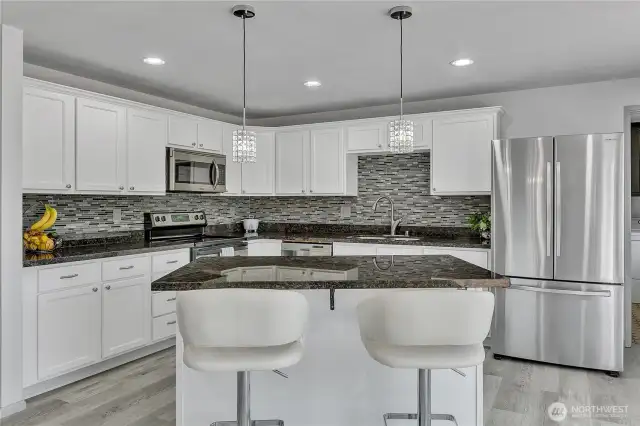 Kitchen with island, granite countertops, stainless appliances