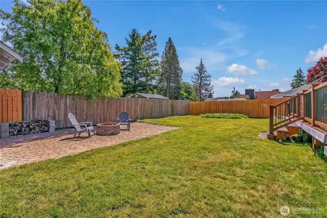 Large backyard with firepit