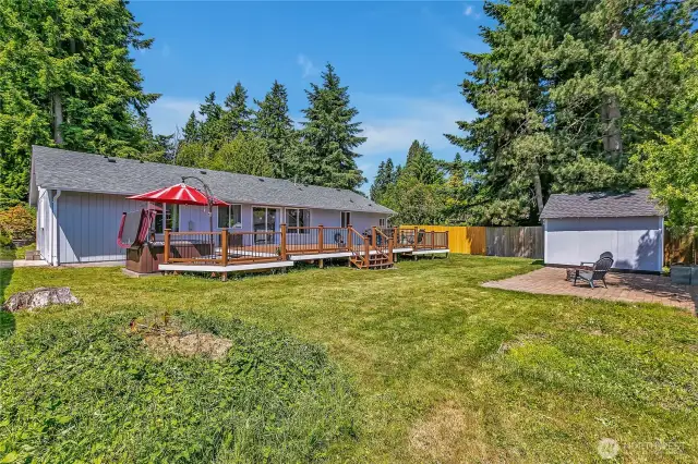 Large backyard with HUGE deck, hottub, firepit and shed