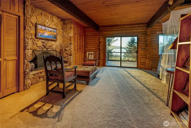 fireplace and deck in the primary bedroom