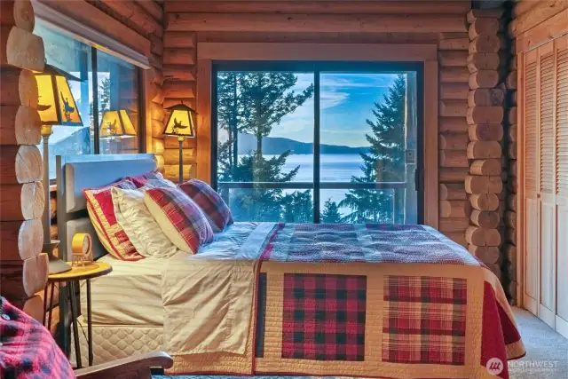 Second main level bedroom with doors to the lower level deck