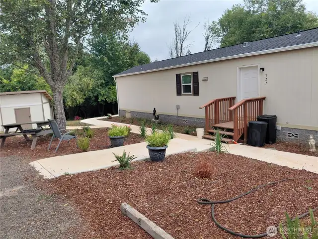 Front of home with low maintenance landscaping