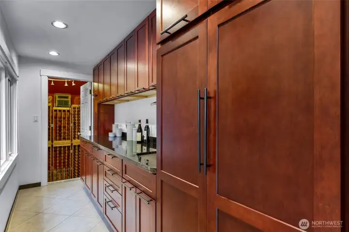 Wet Bar| Butler's pantry or coffee station with sink and insta hot|cold!  Open those cabinets to appreciate all the spice rack and built ins offered!