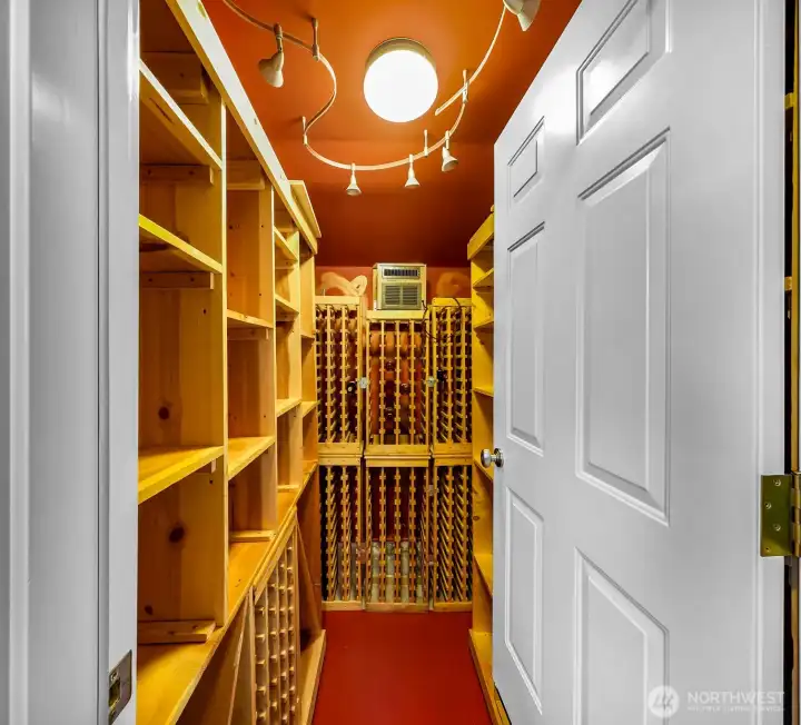Nice size walk in wine room.
