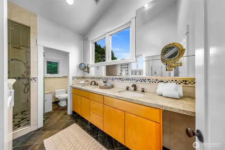 True Deluxe Master bath with heated floors, floating countertop with light and steam room in the shower!
