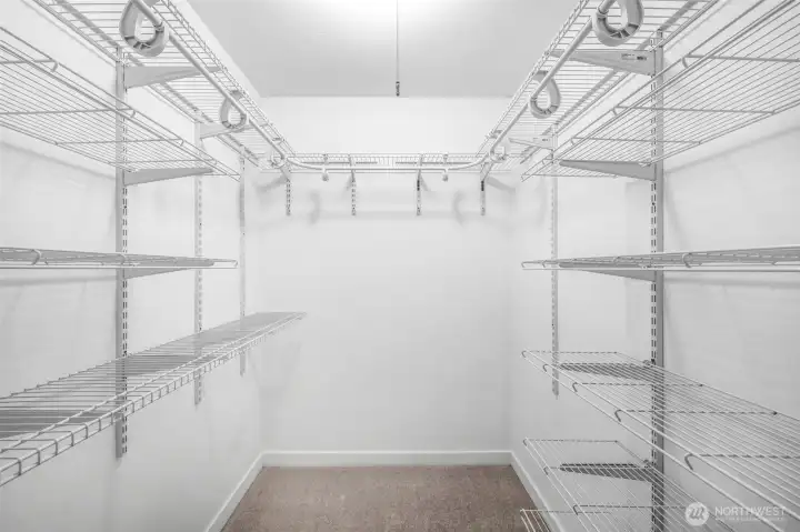 The walk-in closet provides excellent storage with adjustable shelving, ensuring space for clothing and personal items is both organized and accessible.