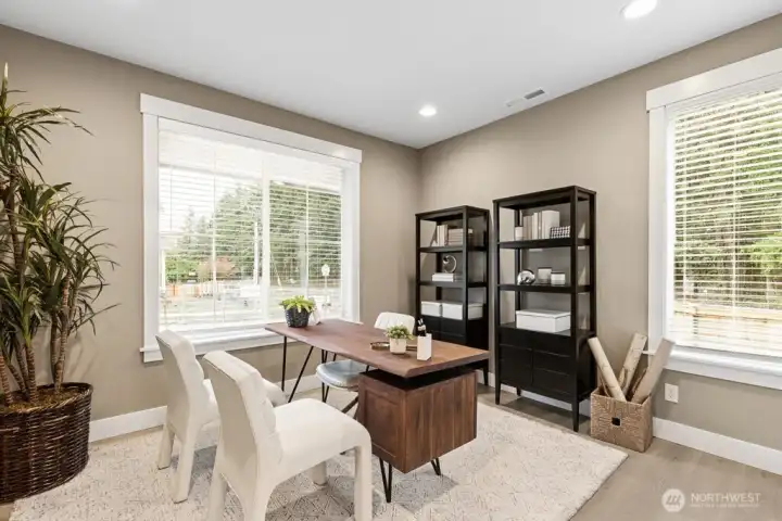 Main floor bedroom/den-Photo of model home