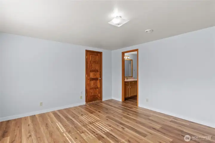 Primary bedroom with attached bathroom