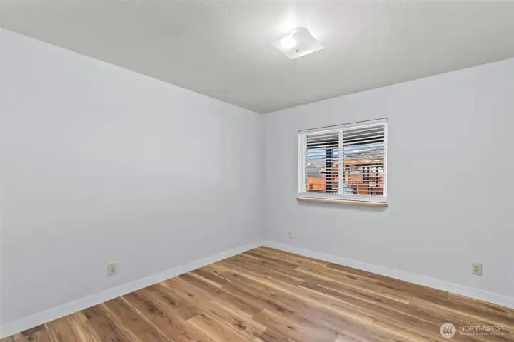 guest bedroom with new laminate flooring