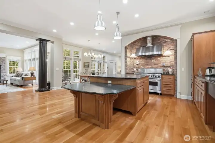 Large soapstone island, expansive wide-plank cherry hardwoods.