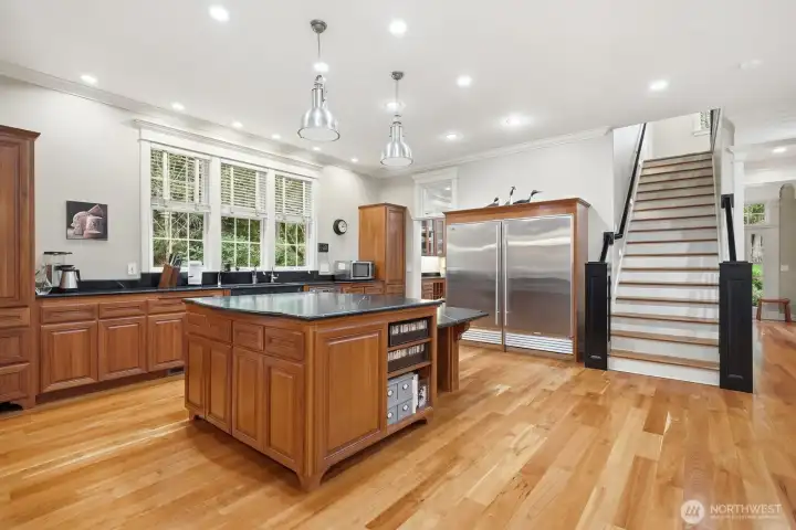 High end professional appliances include a Miele dishwasher, 36-inch side by side Subzero fridge and freezer, farm sink, and huge walk -in pantry with a sink.