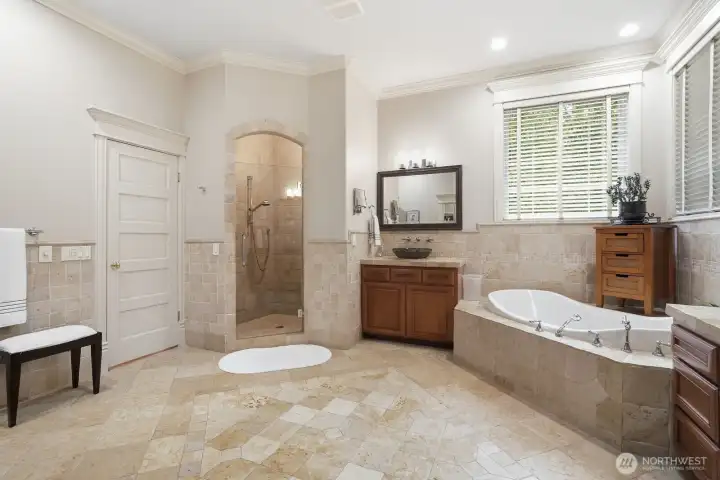 Large walk-in stone surround shower.
