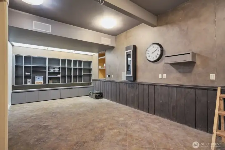 Accessed from doors in the garage is a 410* sq ft finished room with tile floor, wainscoting, gas heater/fireplace and built-ins that could serve as a large home office, home theater, gym or just tremendous storage area.
