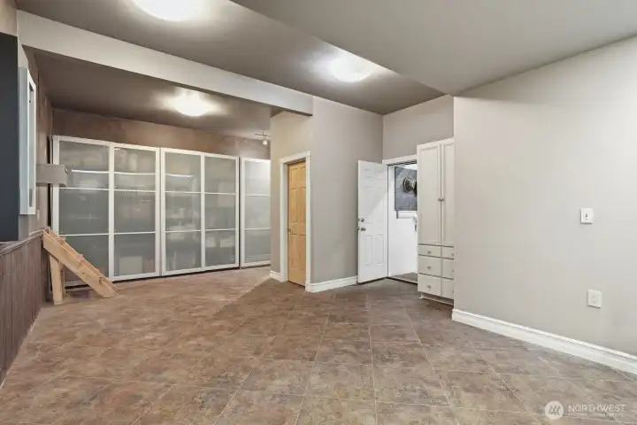 The stand up crawl space is found through a door off this room.