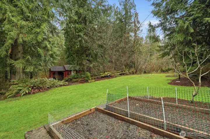The 1.57-acre property backs to greenbelt and features fruit trees, a garden shed, emerald lawns, rear 3 car garage entrance with space for basketball and RV parking.