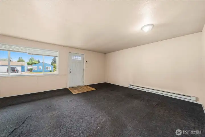 View of the living room and entry from the hall