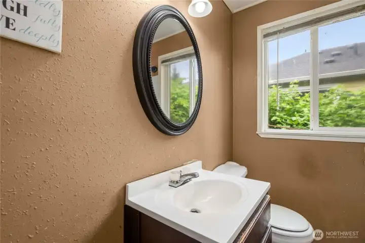 Full bathroom with window and storage!