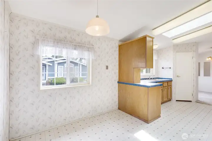 Additional eating space adjacent to kitchen.