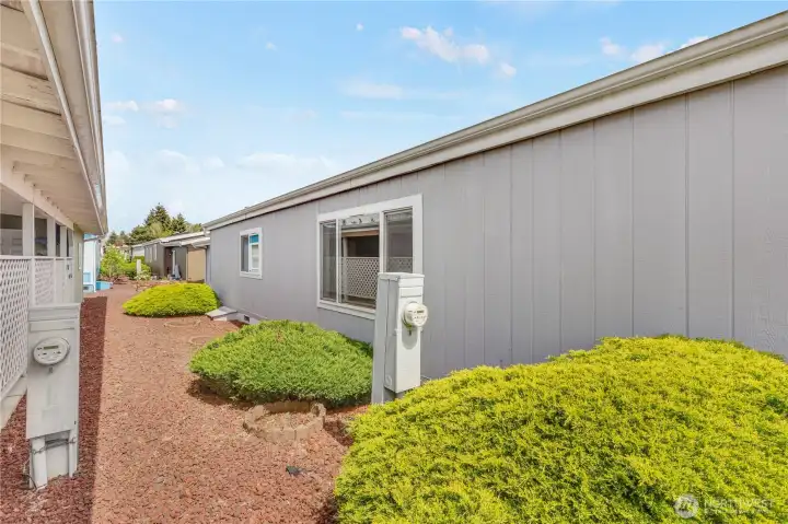 Surrounded by neatly manicured landscaping.