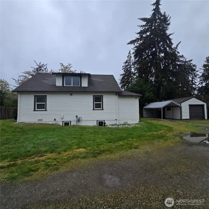 Showing the Home with the Detached Garage and carport. Lots of parking here!