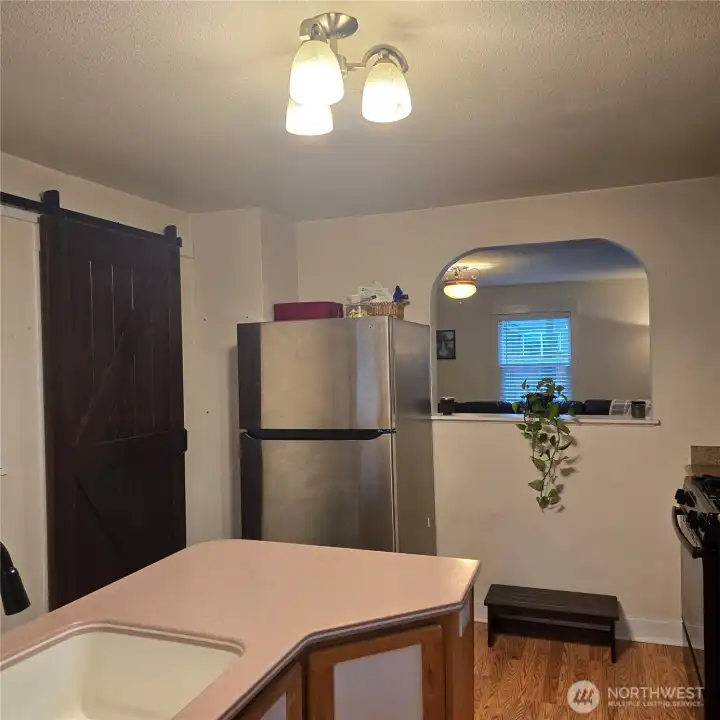 Kitchen looking into living room