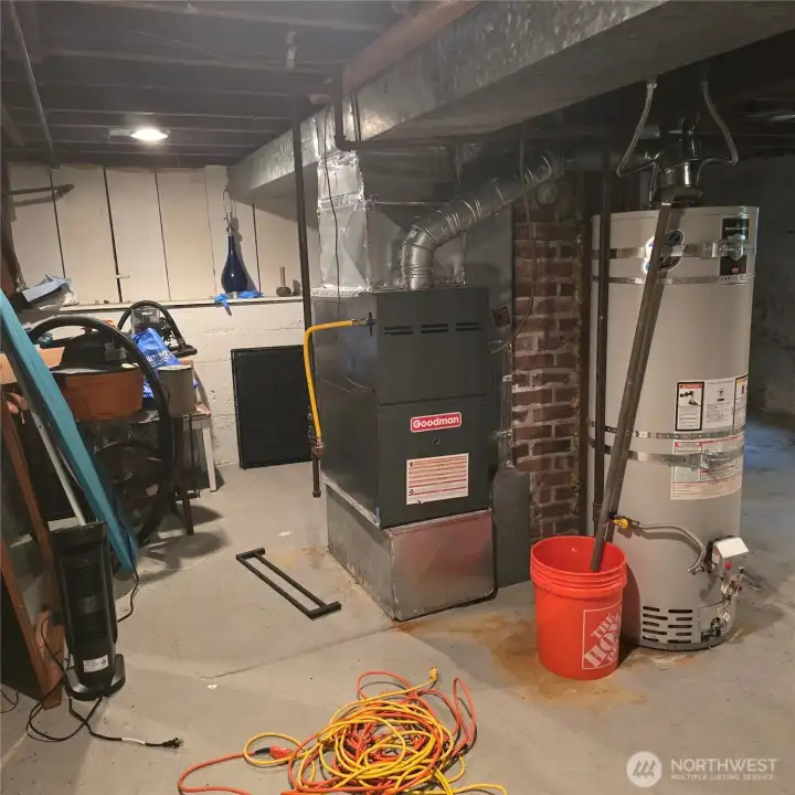 Newer Furnace and Hot Water Tank in the Storage area in the Unfinished Basement area